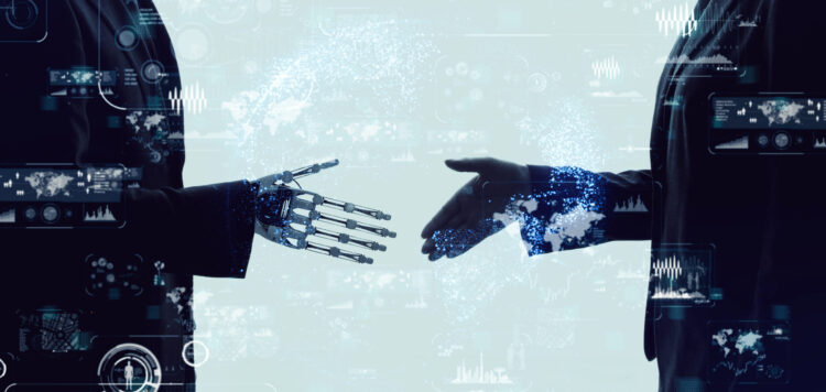 Shaking hands of a businessperson and a robot.
