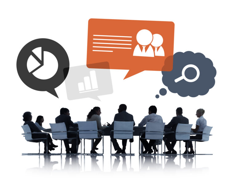 Silhouettes of Business People Discussing Teamwork